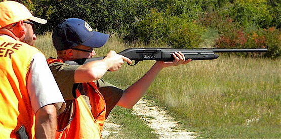 Kaleb Hinkle shooting clay pigeons at Basalt SWA shooting range. Brian Wodrich, DWM, assists.