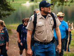An interpreter leads an educational hike at  Sylvan Lake State Park.