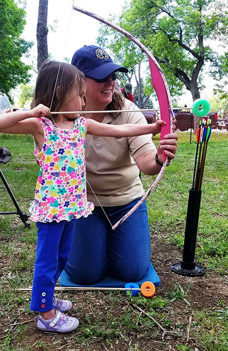 Little girl shooting archery