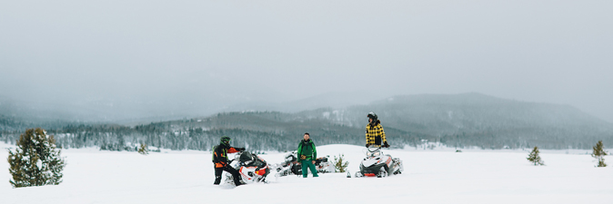 Snowmobilers pause for a break.