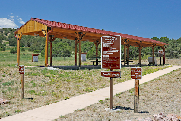 Covered picnic facilities and posted range rules.