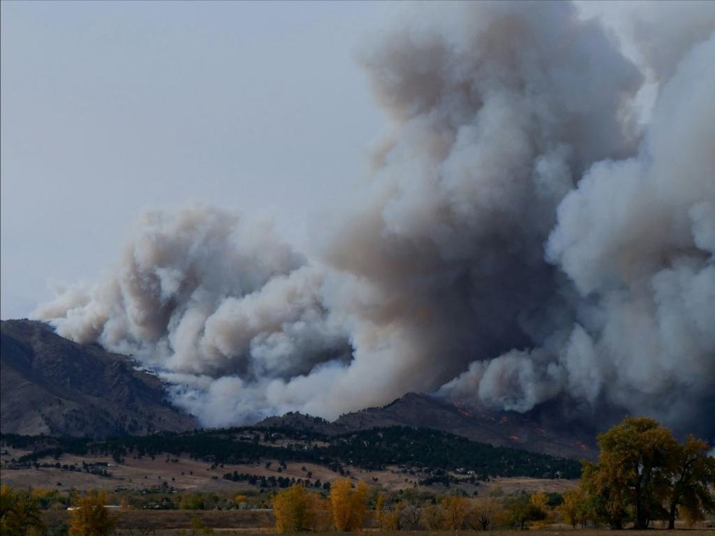 Smoke from wildfire on mountain landscape