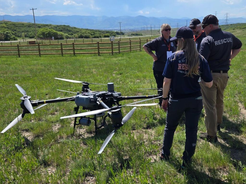 Search and rescue staff stand around a 6 foot drone
