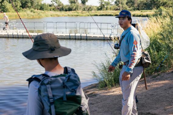 Youth cast out during a fishing clinic in Sterling, CO, made possible by Outdoor Equity Grant funds.