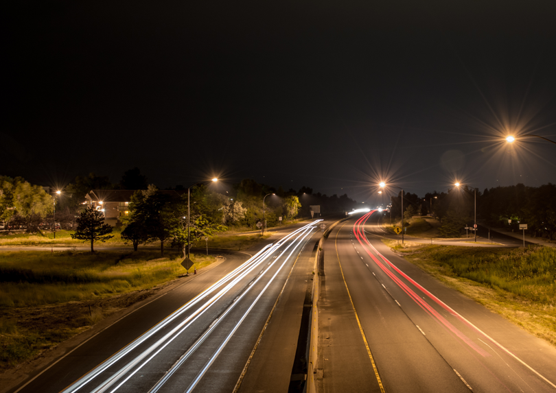 A road at night. Lights and roads are a form of human interference.
