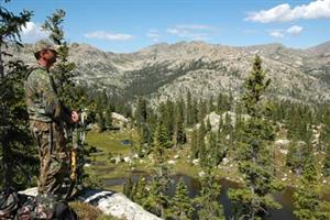 Bowhunter Overlooking Valley © T.Baskfield/CPW