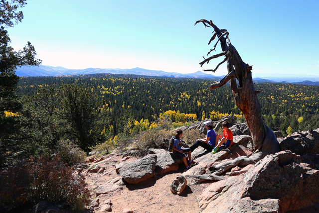 Hikers enjoy the fall colors at Mueller State Park.