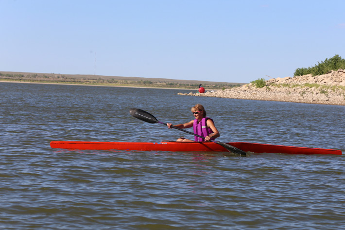 woman in long kayak