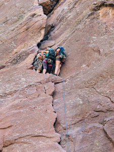 climbers grouped on a ledge