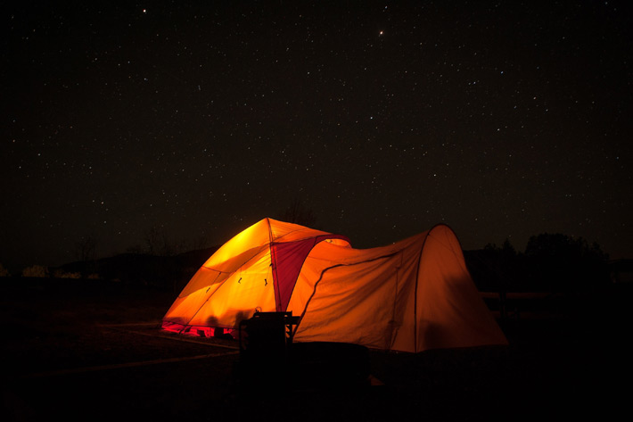 Navajo glowing tent with background of stars