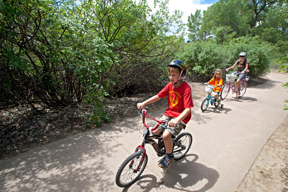 A family riding a paved trail at James M. Robb State Park. Photo by Ken Papaleo.