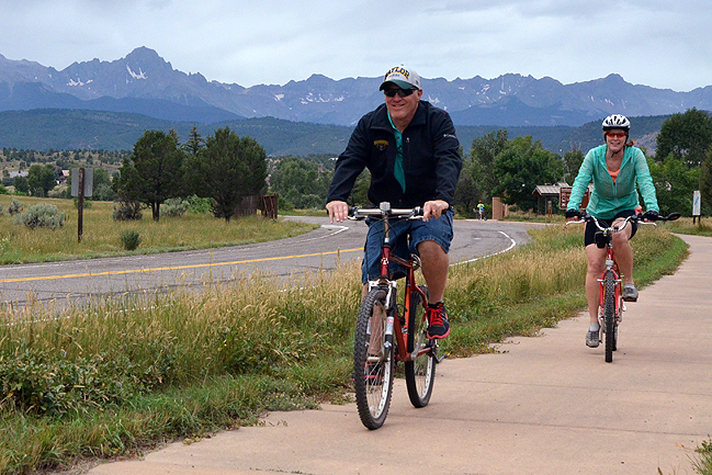 A family riding the Ridgway State Park paved trails into town.