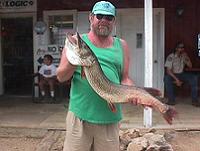 Man holding trophy Northern Pike