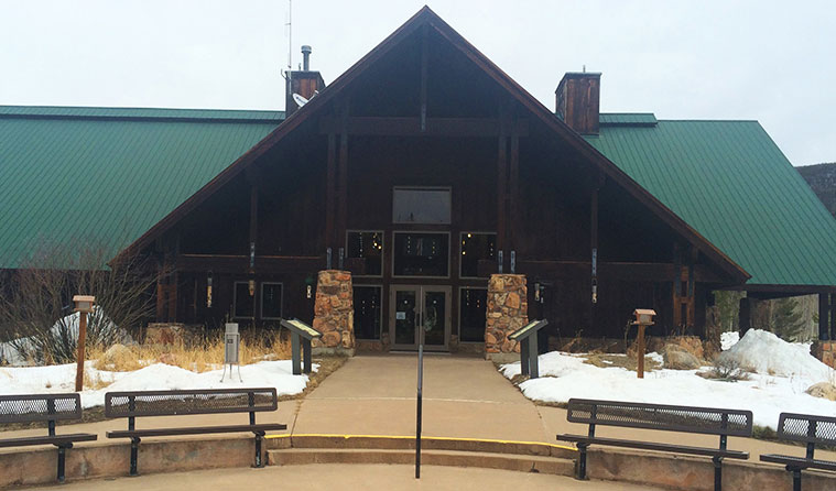 A photo of the front entrance of the State Forest Moose Visitor Center